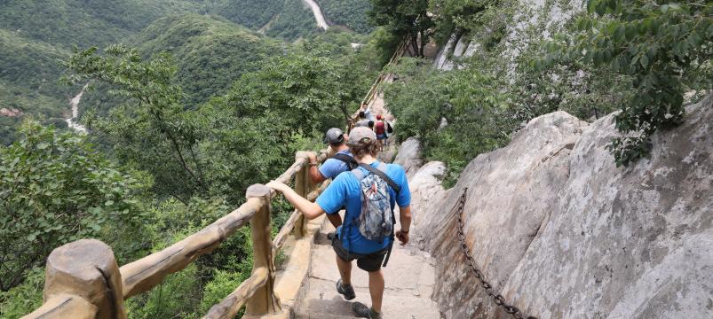 Beloit professors and students climb down a steep trail along the Yellow River in China.