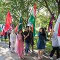 International students led the march, proudly hoisting their countries' flags.